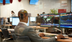 An image of a person working on a computer to improve network resilience