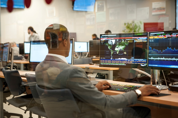 An image of a person working on a computer to improve network resilience